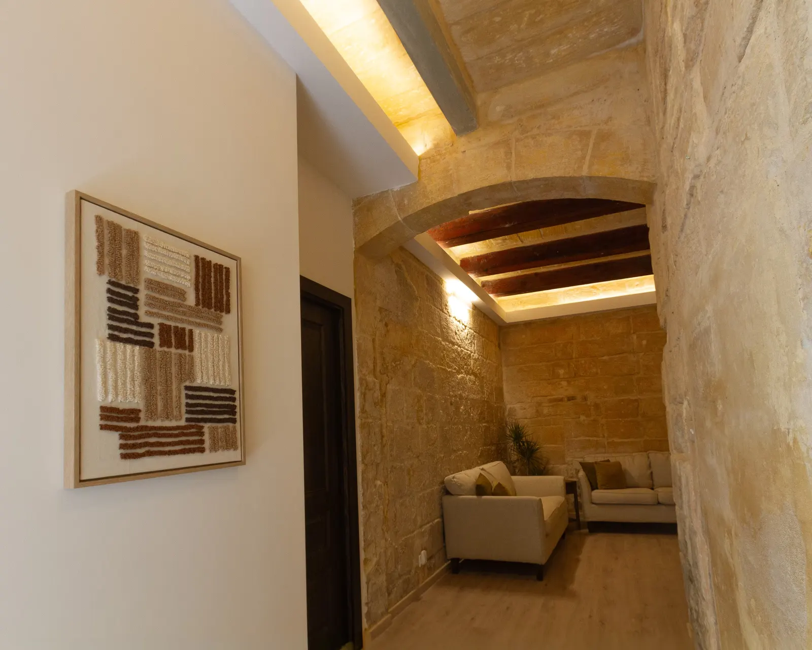 Lit corridor with abstract art