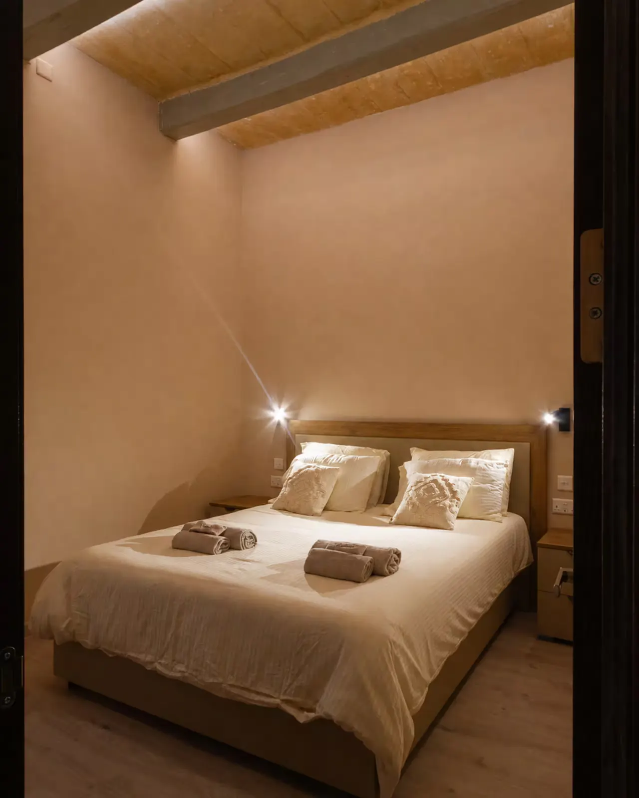 Queen bedroom with warm lighting