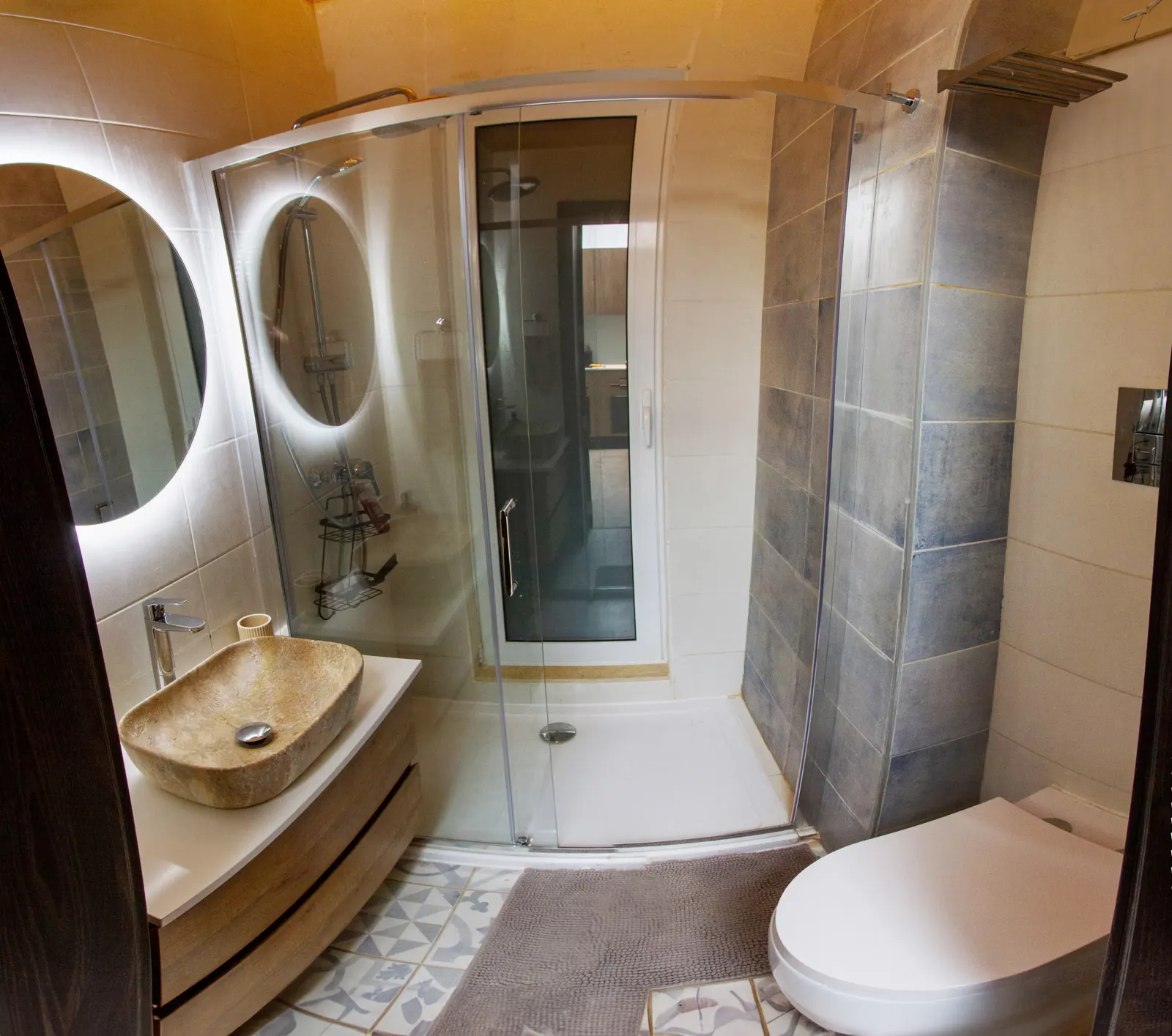 Bathroom with stone basin and walk-in shower